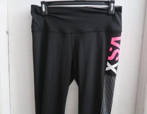 Victoria's Secret VSX sport knockout tight leggings in black, white and pink size medium.