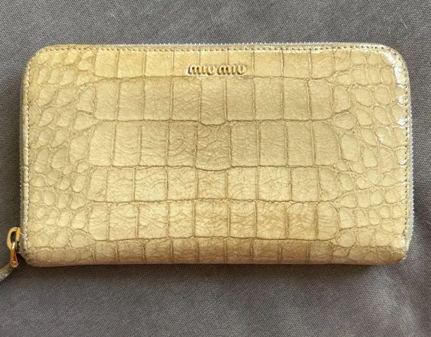 Miu Miu Metallic Gold Croc-Embossed Wallet with light blue interior.
