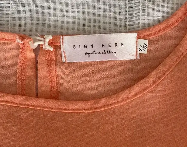 Sign Here Signature Clothing drop waist dress in pastel peach.