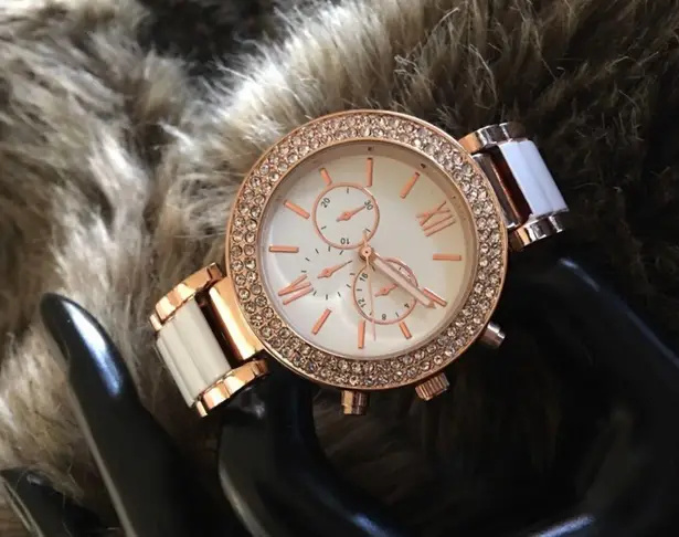 Ladies rose gold tone rhinestone cuff watch