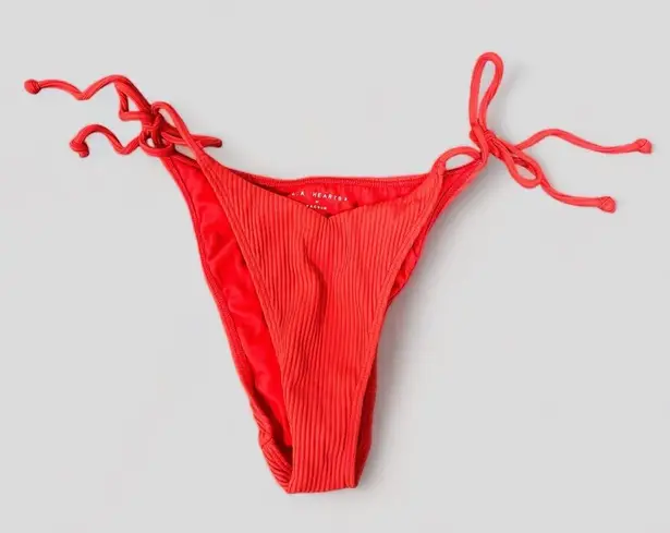ribbed side tie bikini bottoms in red