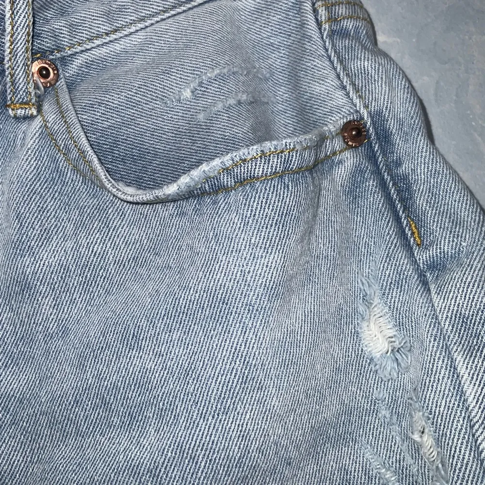 Simple Society Light Wash Blue Fringe Distressed Ripped Button Fly Jean Shorts 7 - Image 4