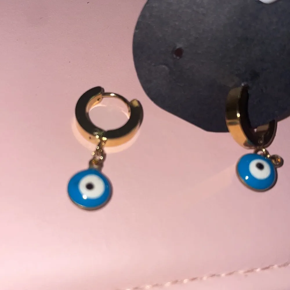 Evil eye Gold Huggies earrings - Image 16
