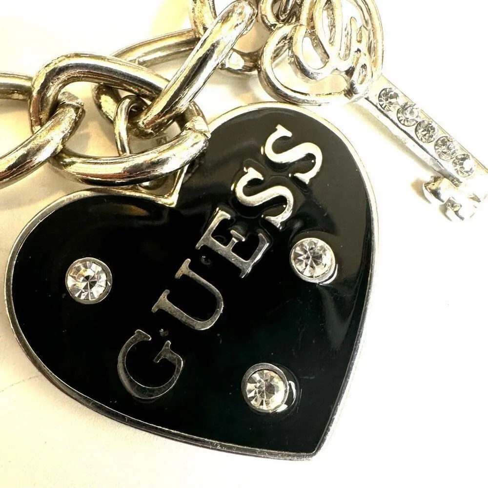 GUESS SILVER TONE CHAIN BLACK HEART CRYSTAL LOGO LOCK & KEY CHARM BRACELET - Image 9