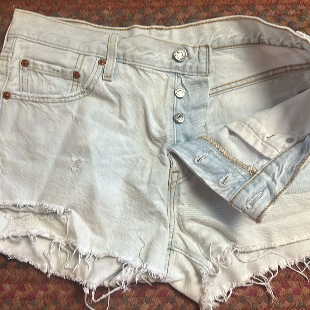 Levi's  BUTTON FLY LIGHT WASH PATCHWORK DISTRESSED CUT OFF SHORTS - Image 4