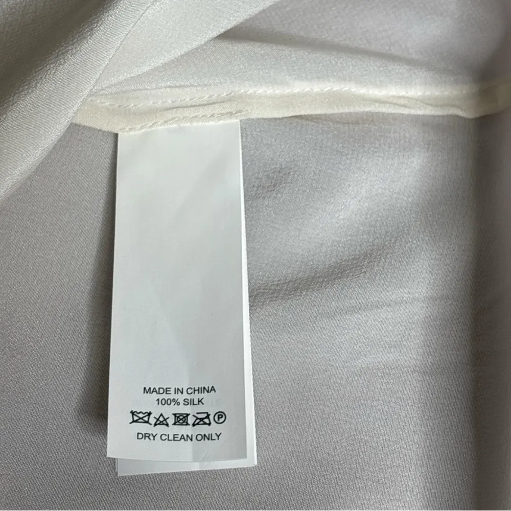 Kate Spade Cream Ruffle Neck Blouse
100% Silk - Image 4