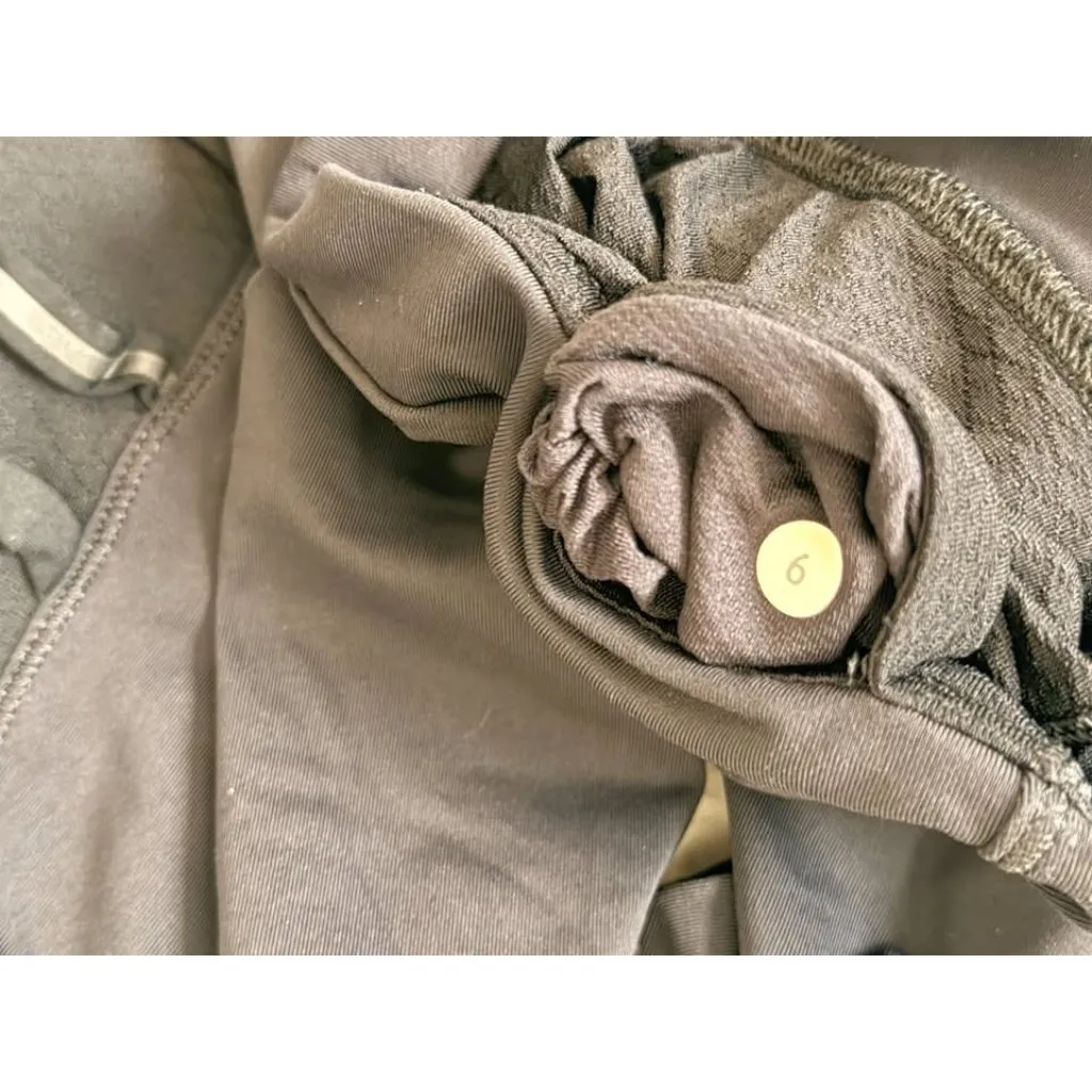 Lululemon women's size 6 black cropped leggings with reflective accents on sides - Image 2