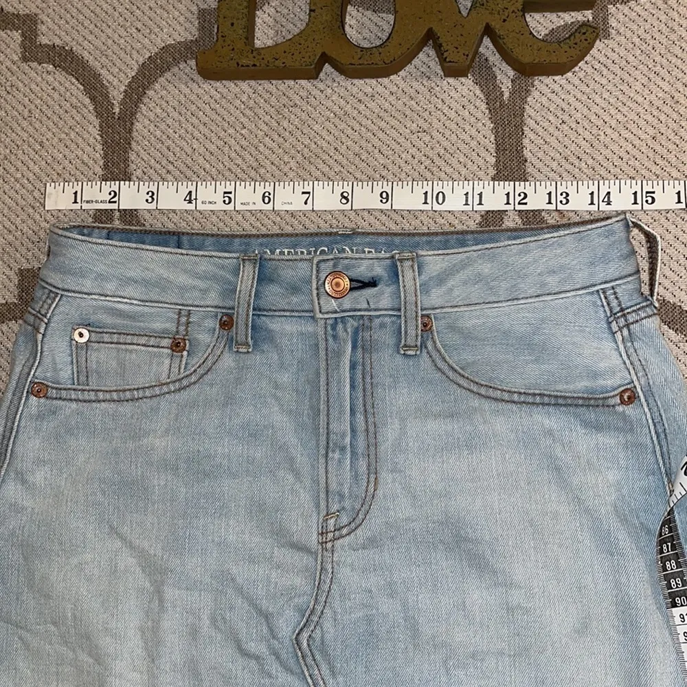 American Eagle Outfitters distressed light wash mini denim skirt - Image 14