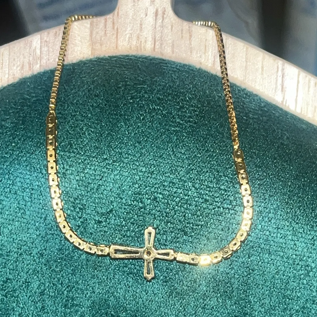 Adjustable up to 9 3/4” gold tone and crystal cross bracelet. - Image 3