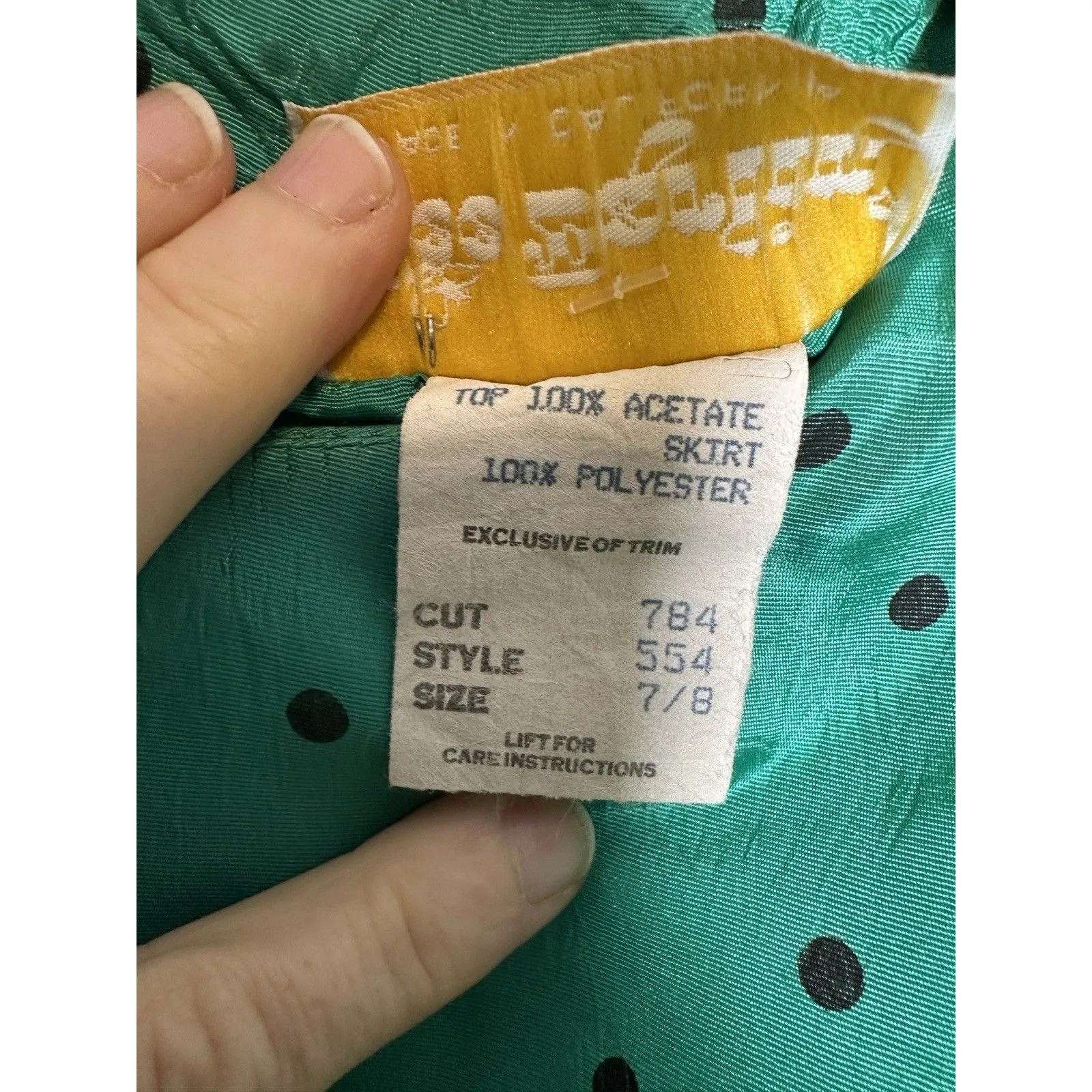 vintage‎ 80s-style dress with a green polka dot top and a black pencil skirt. - Image 7