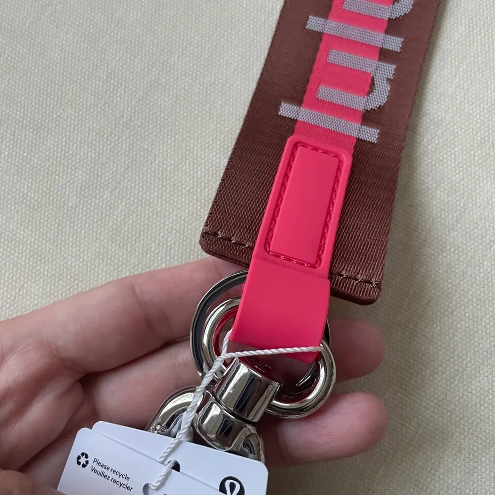 Never Lost Keychain Wordmark - Ancient Copper/Glaze Pink - Image 7