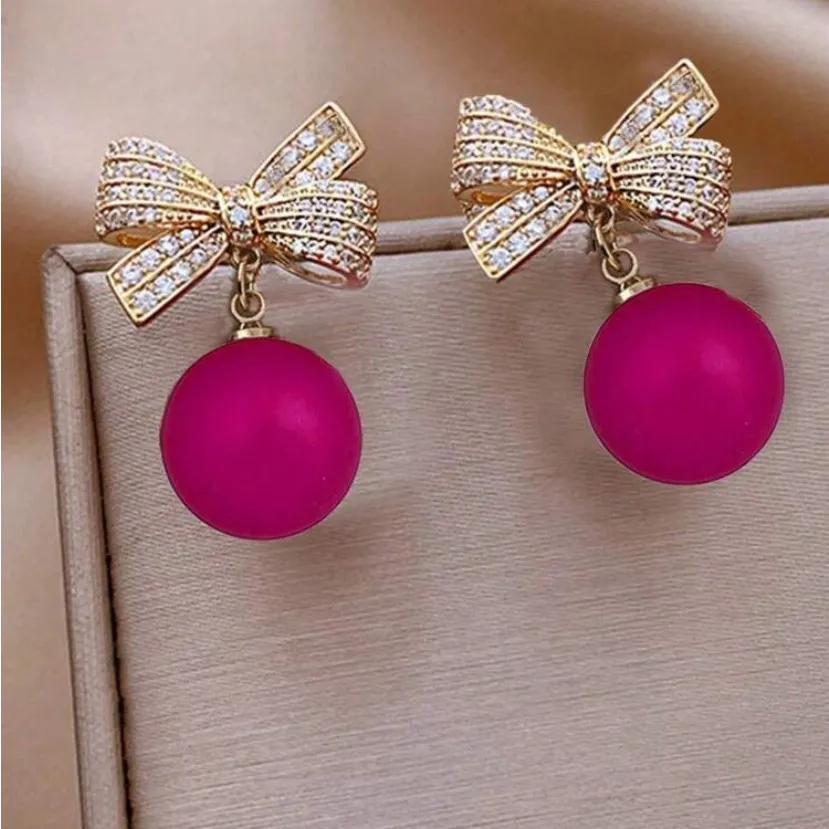 Gold and Pink Bow Earrings - Image 2