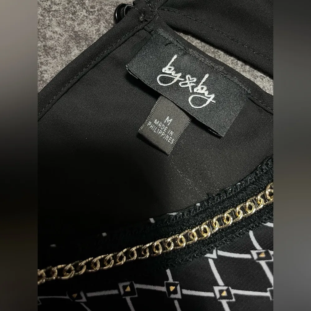 Dressy Black with White Design Sleeveless Top
By By sz medium - Image 3