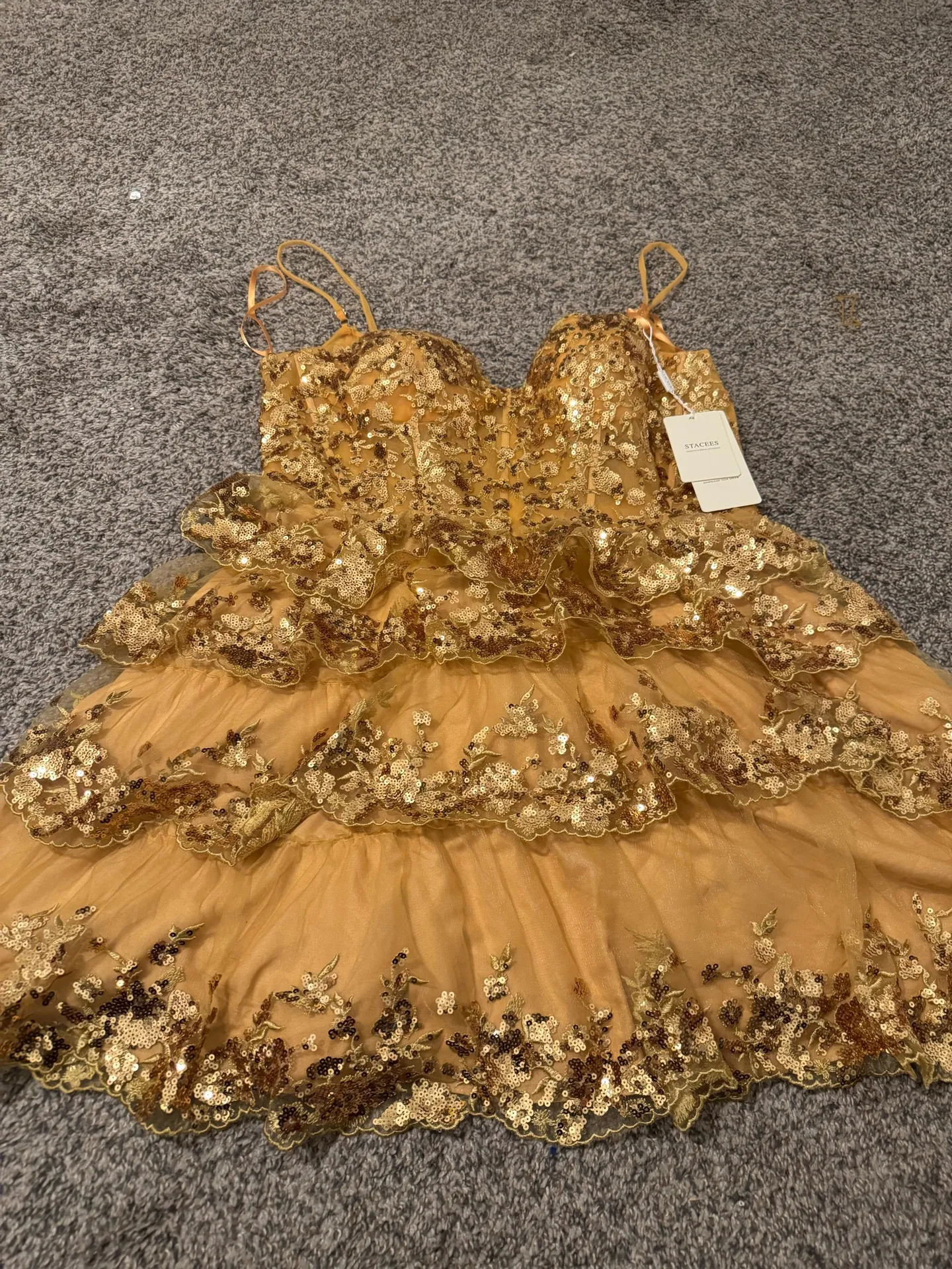 Dazzle in this stunning golden lace mini dress, perfect for any celebration. The tiered design and delicate lace offer a chic and elegant look. - Image 6