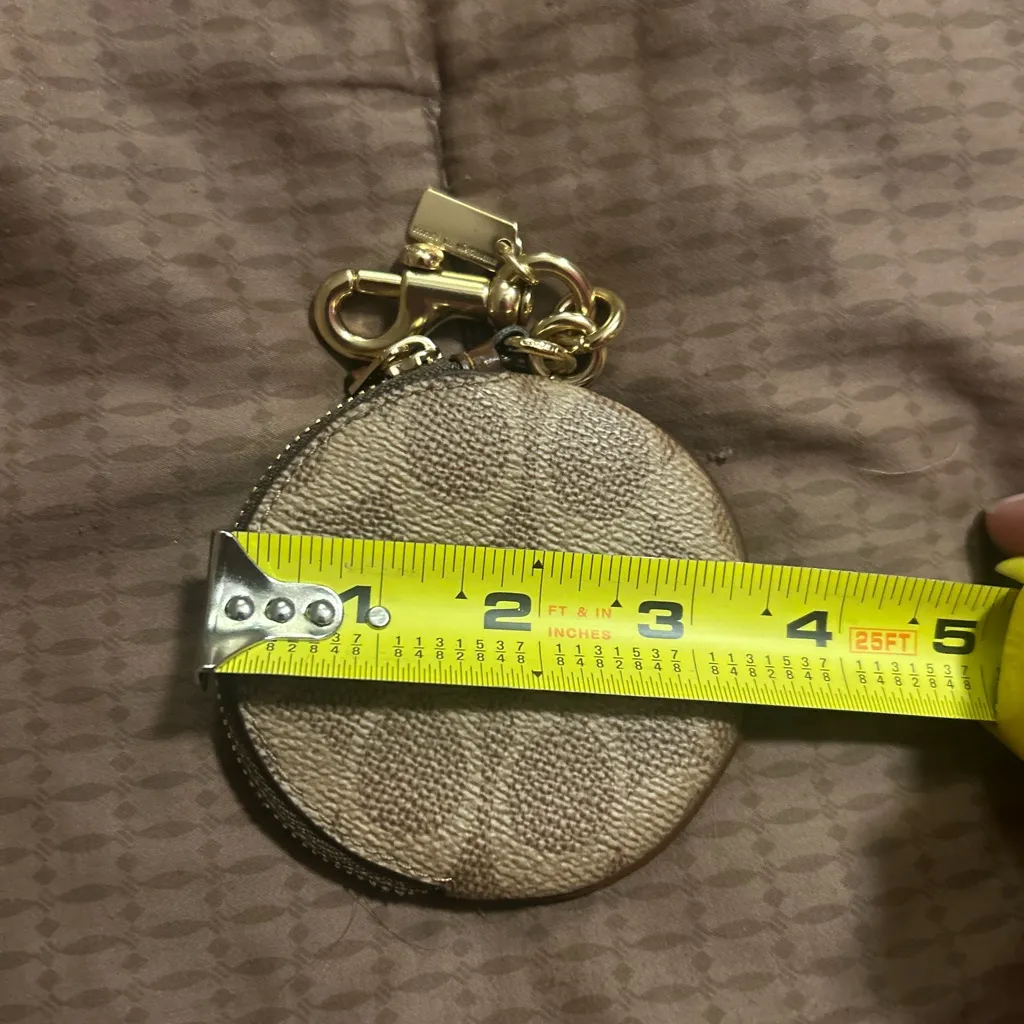 Coach Signature Canvas Circular Coin Pouch bag charm in the color khaki brown - Image 3