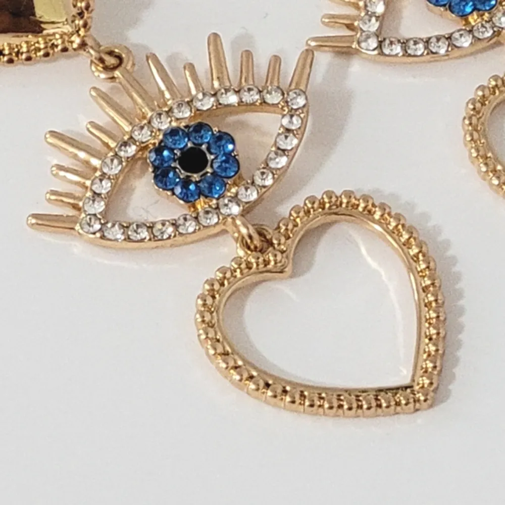 Gold Tone Heart & Evil Eye Rhinestone Dangle Earrings - Image 2