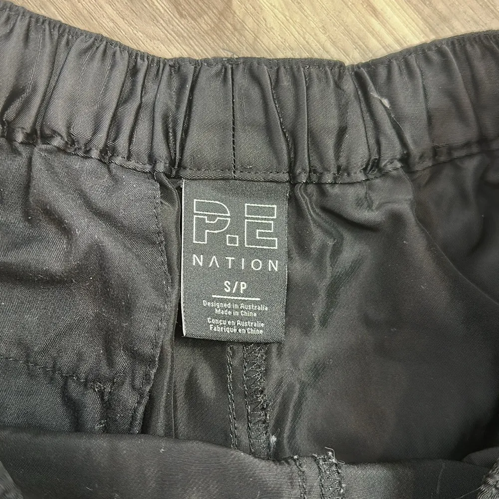 P.E Nation black athletic regain shorts size small - Image 3