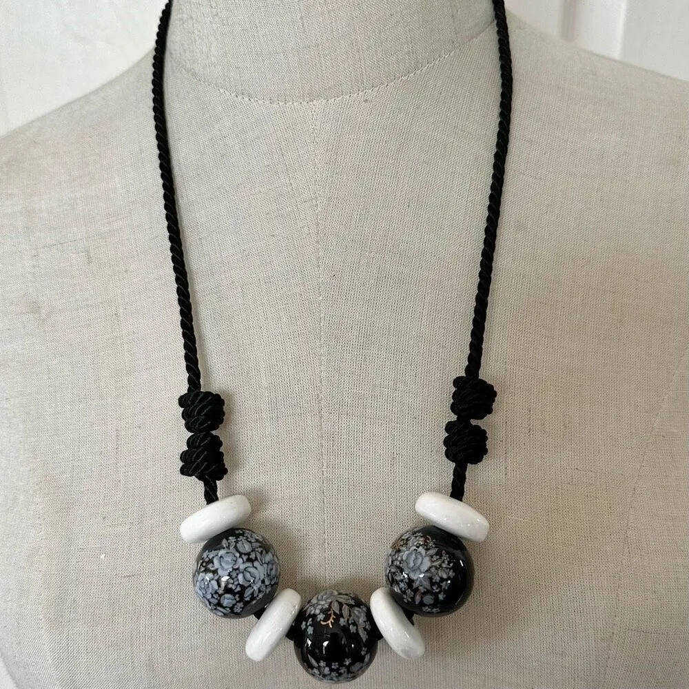 Black floral and white beaded necklace on black cord - Image 2