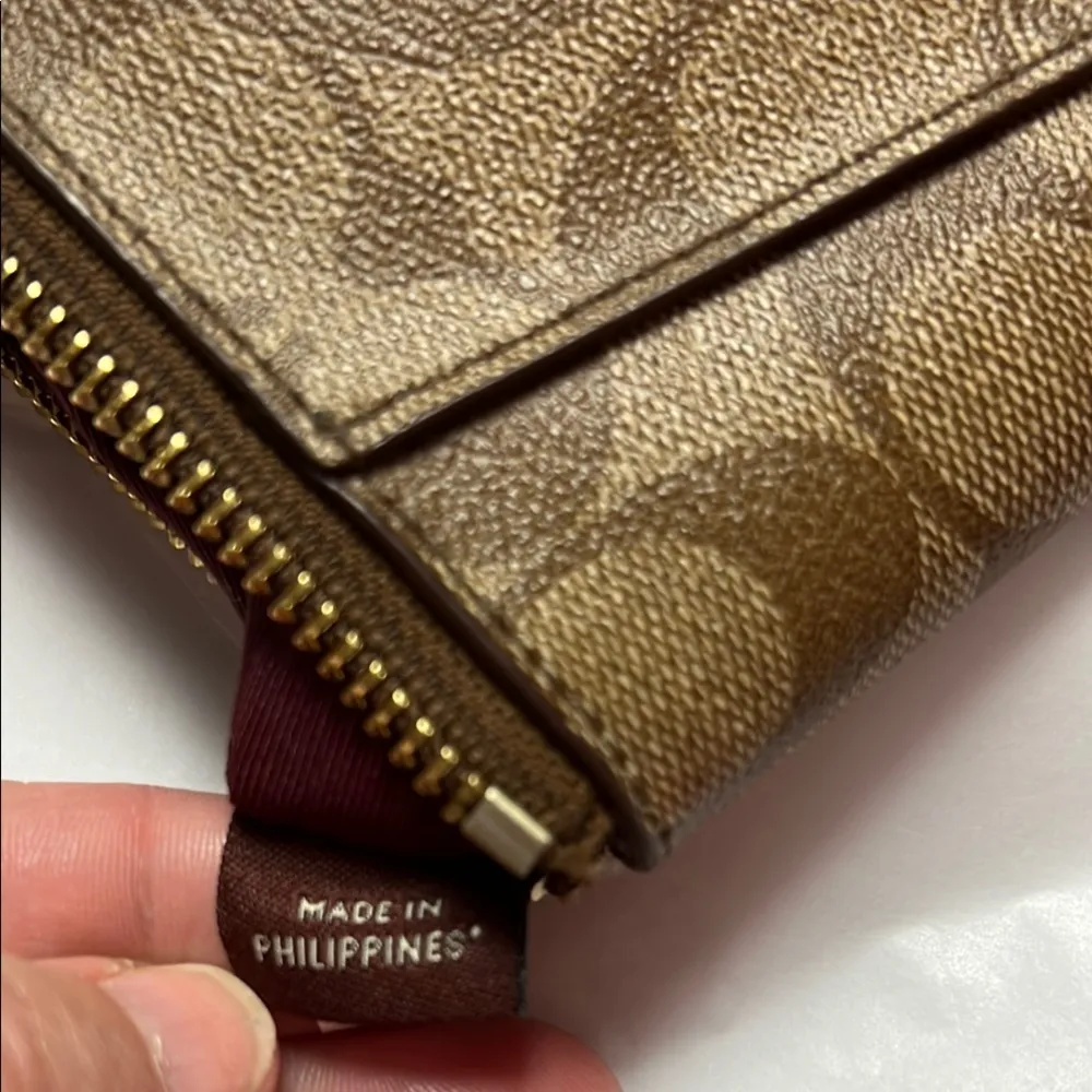Coach Brown Clutch with Monogram Pattern and Zipper Closure - Image 8