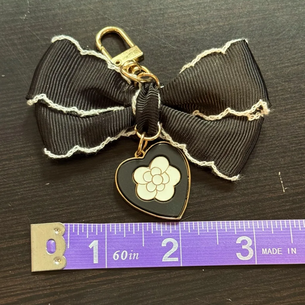 Black and White Enamel Camellia and Ribbon Bow Gold Bag Charm Keychain - Image 3