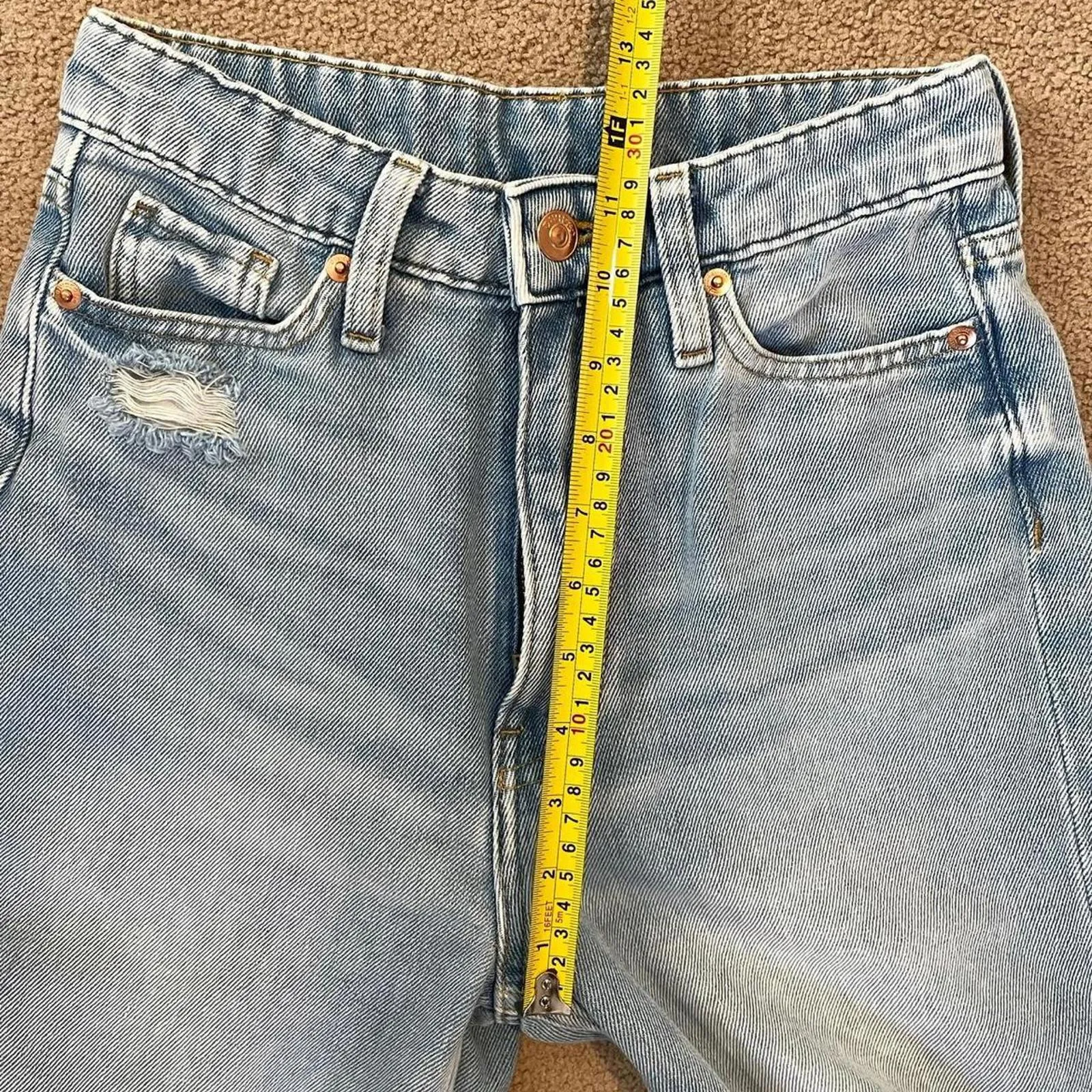 High-waisted, light-wash denim jeans with rips at the knees from h&m. size 2 - Image 6