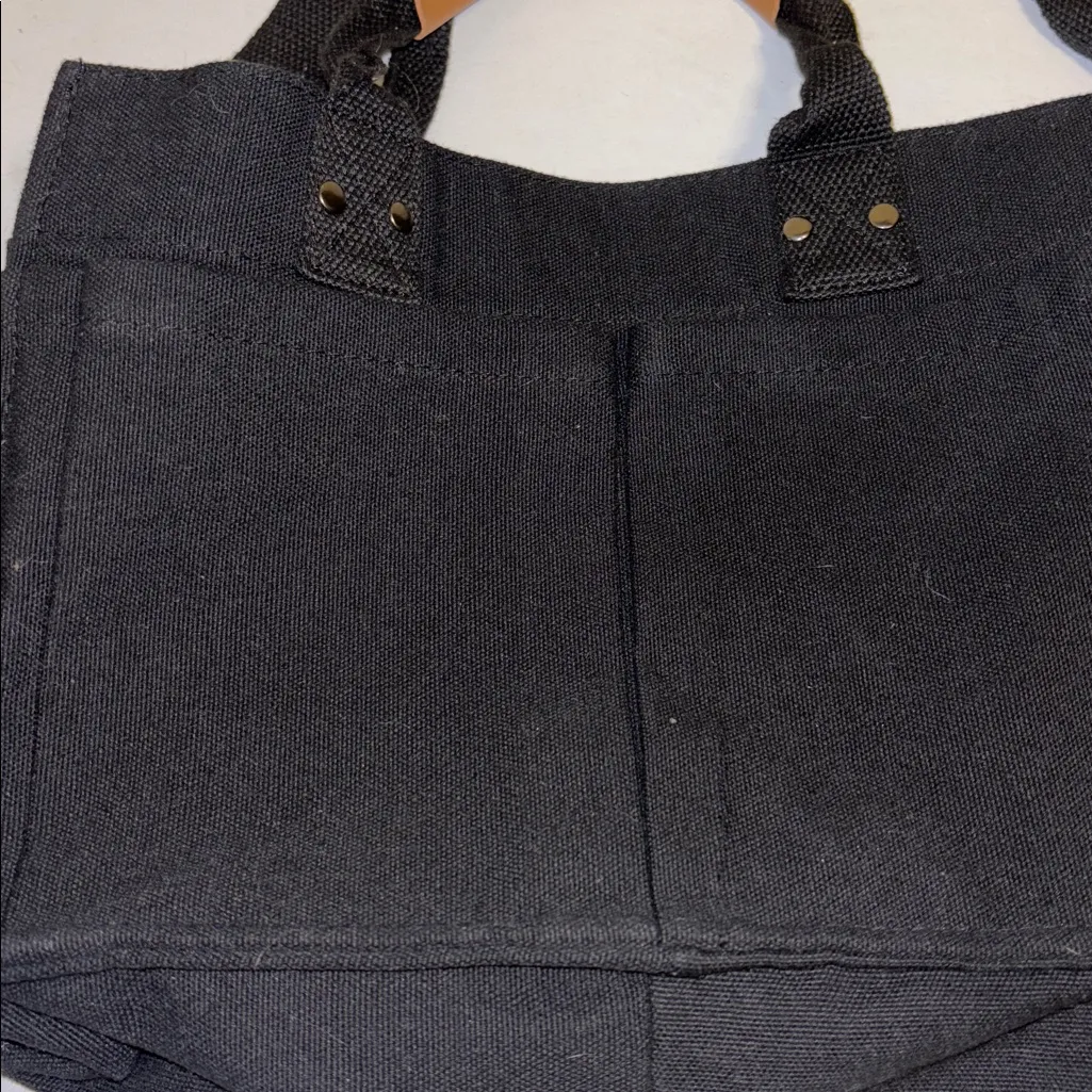 Black Canvas Tote Bag Brown Accents Detachable Strap 6 Pockets Outside on Bag - Image 2