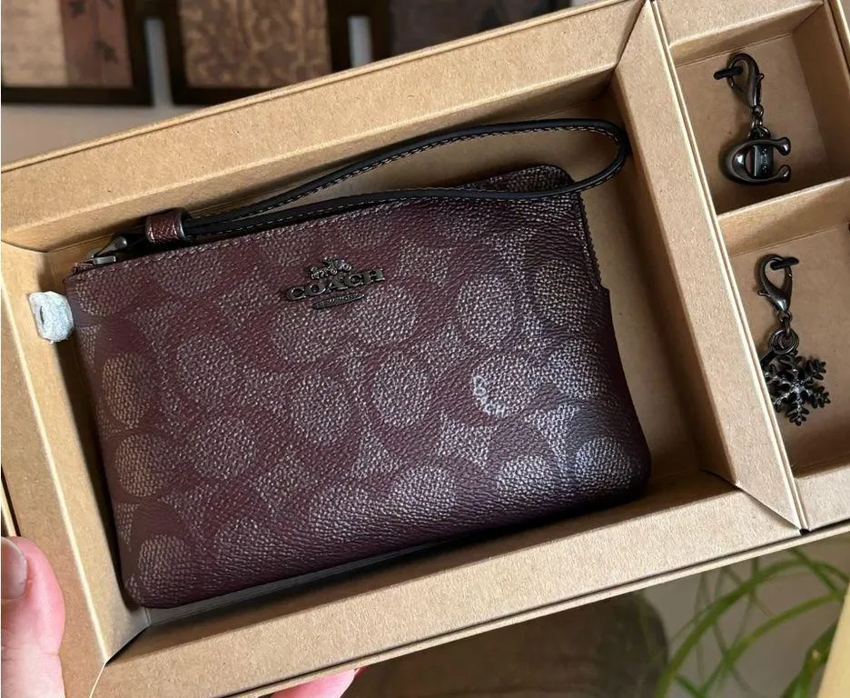 Authentic COACH signature shimmery Leather wristlet and 2 charms set in box 🎁 - Image 2