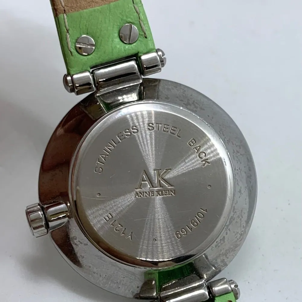 Anne Klein 10/9169 womens Quartz analog watch silver tone 34mm green band runs - Image 6