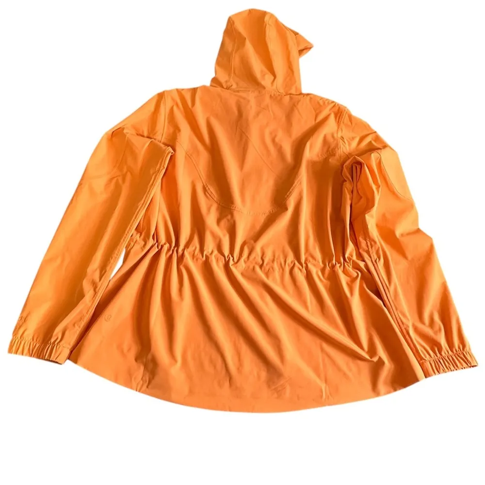 Lululemon Athletica Orange Raincoat with Hood and Water-Resistant Fabric - Image 3
