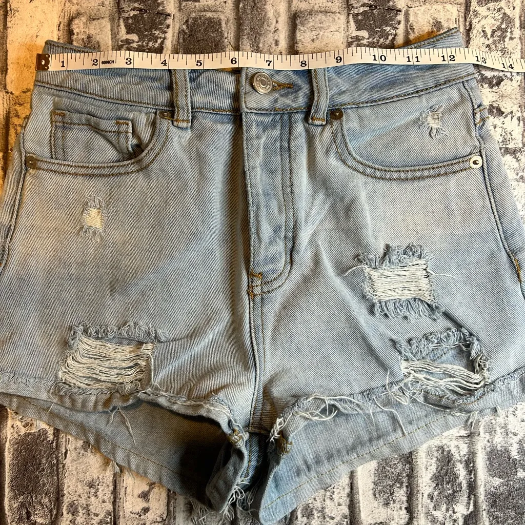 Brandy Melville Light Blue Ripped Jean Shorts - Image 6