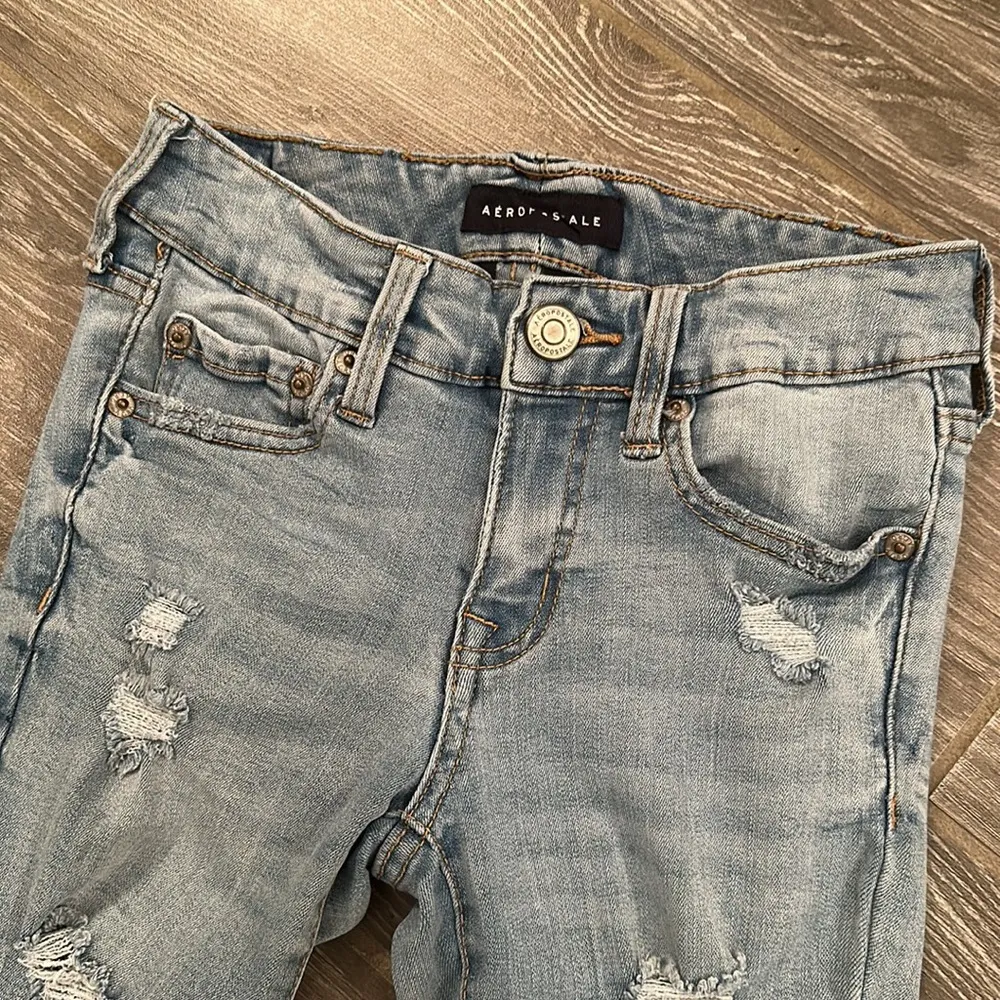 Women’s  size 0 low rise jegging light wash destroyed stretchy jeans - Image 2