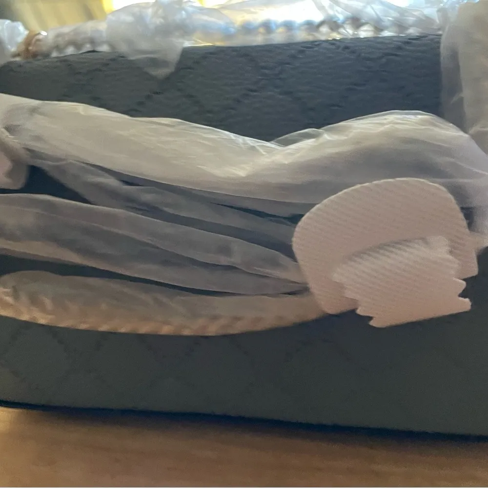 Nine West
Kyelle Flap Embossed Mini Crossbody Bag - Image 7