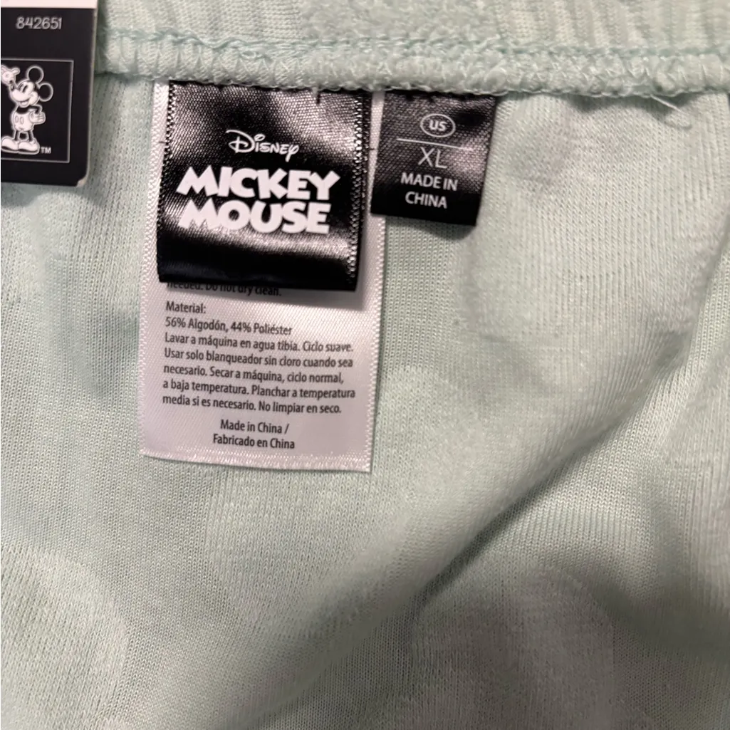 Charming Disney mini skirt in light green. Features subtle pattern. - Image 4