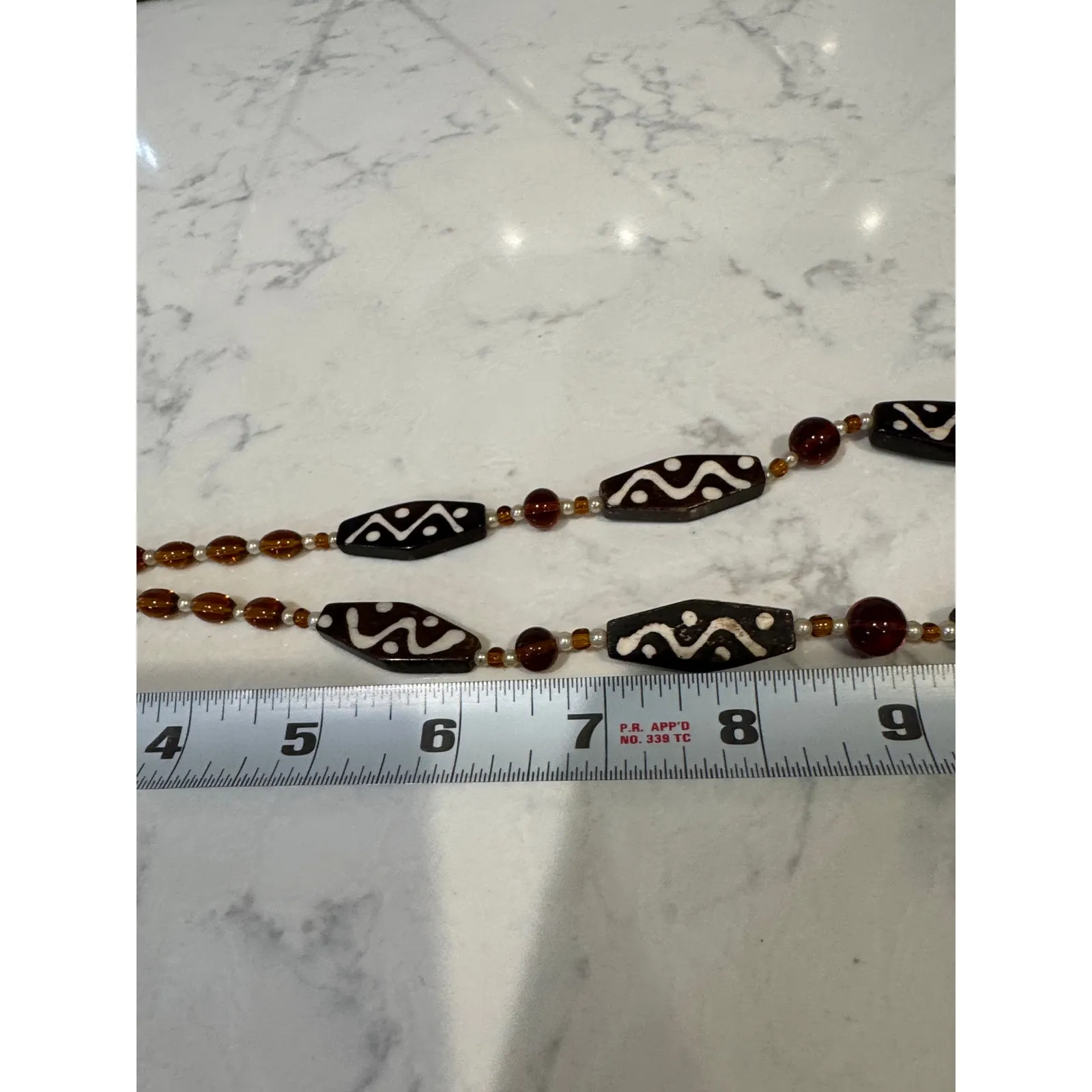 handcrafted ethnic style beaded necklace dark brown oval beads etched pattern - Image 7