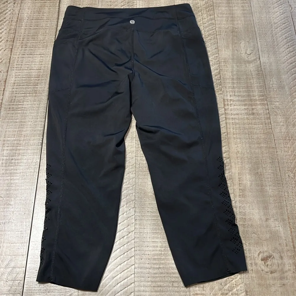 3:$25 Tangerine capri leggings with cute cut outs down outside of each calf. - Image 5