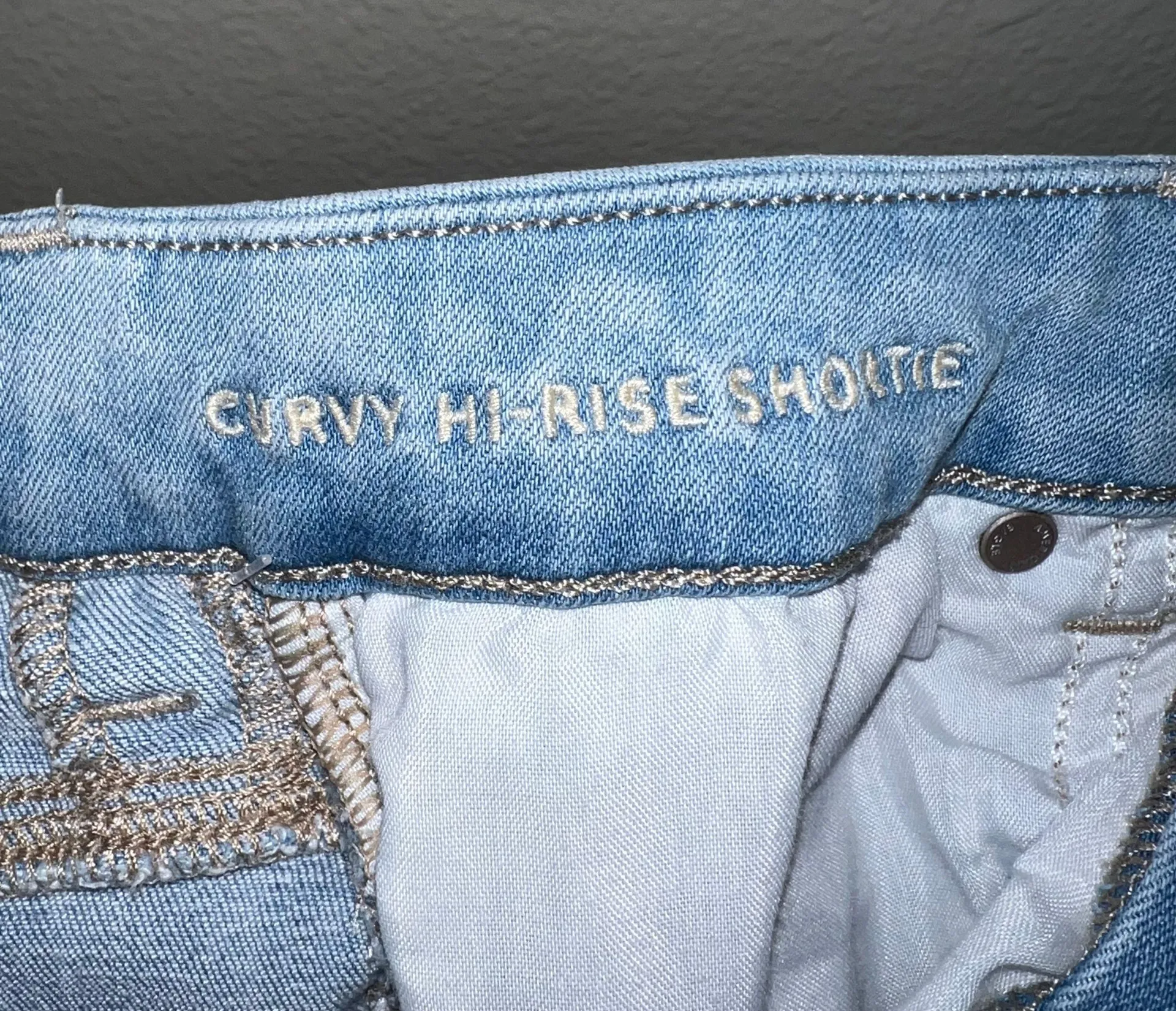 AE Distressed Next Level Stretch Curvy Hi Rise Shortie Shorts - Image 5