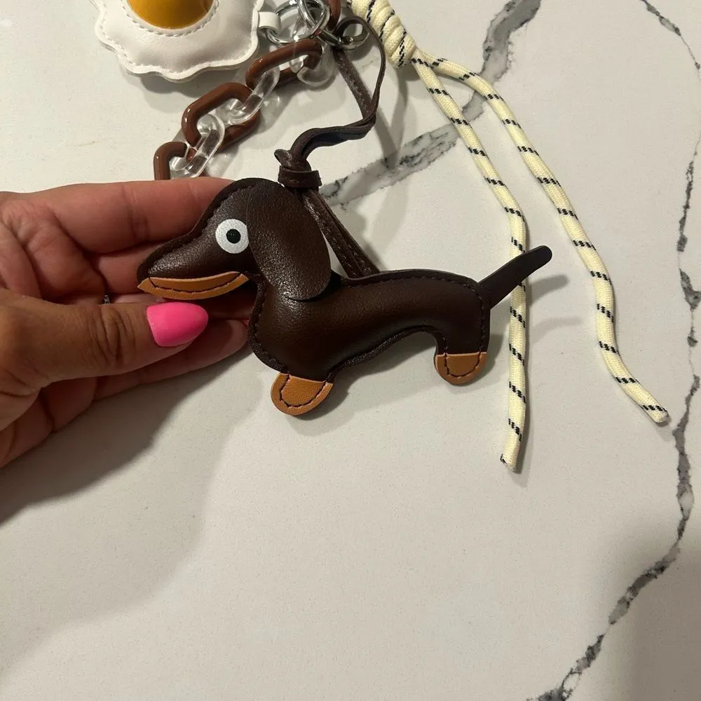 Brown Dachshund Keychain with Egg Charm
Faux leather - Image 2