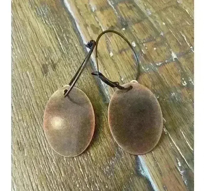 Boutique Bronze & Silver Two-Toned Cross Oval Metal Hoop Earrings - Image 4