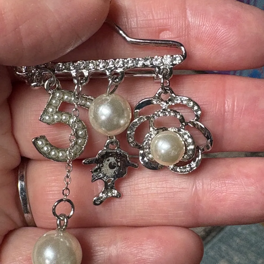 Whimsical Silver and White Charm Brooch - Image 3