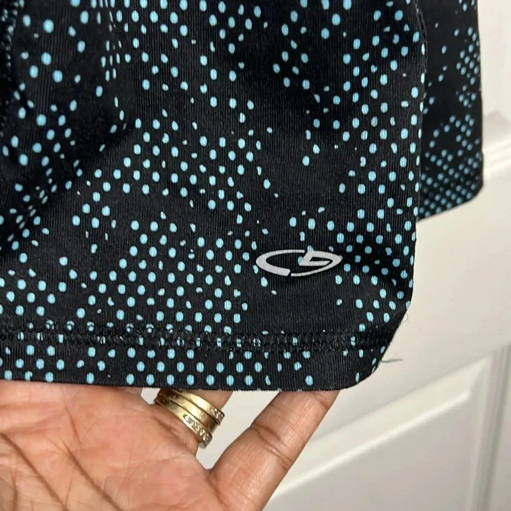Champion activewear top.  Size large. 1/2 zip pullover. Black with blue dots. - Image 5