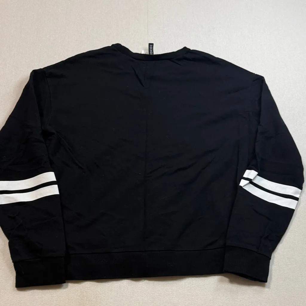 Divided Black Crewneck Sweater with White Accents - Image 7