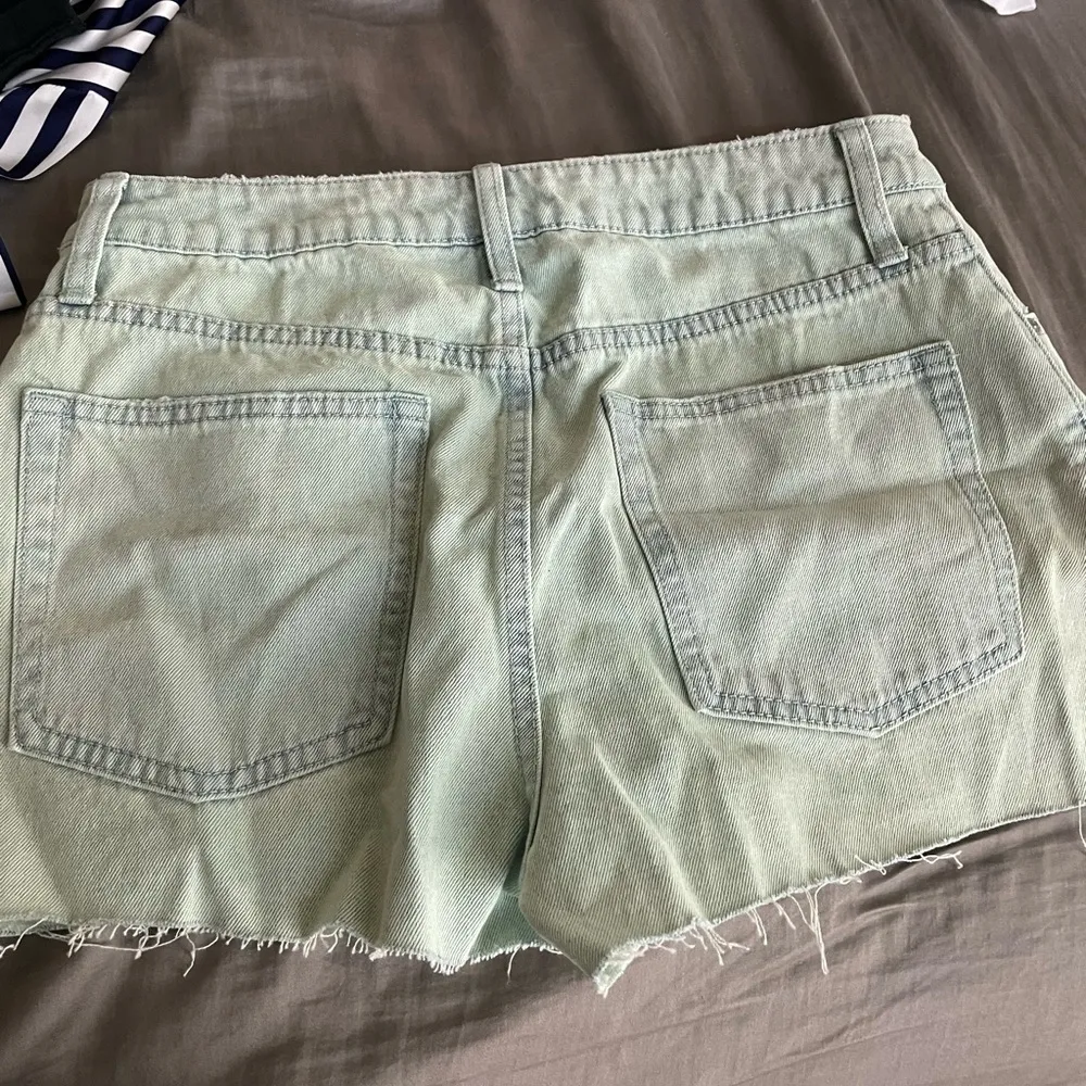 Light green blue Jean cut off shorts. - Image 3