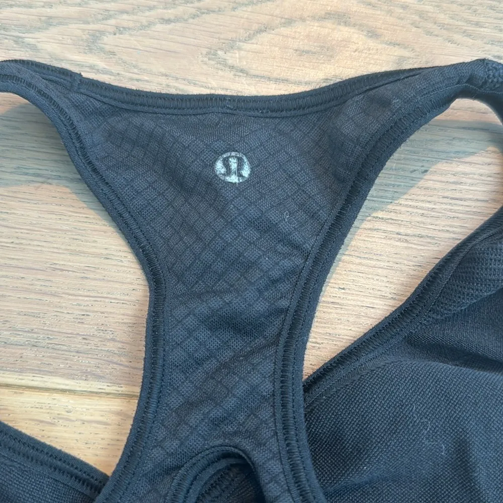 black lululemon sports bra in good condition except for the logo fading - Image 3