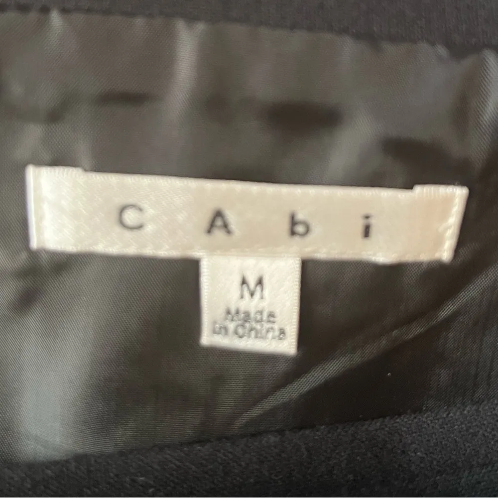 CAbi #926 Stretch Textured Asymmetrical Hem Button Wrap Mini Skirt Black sz M - Image 4