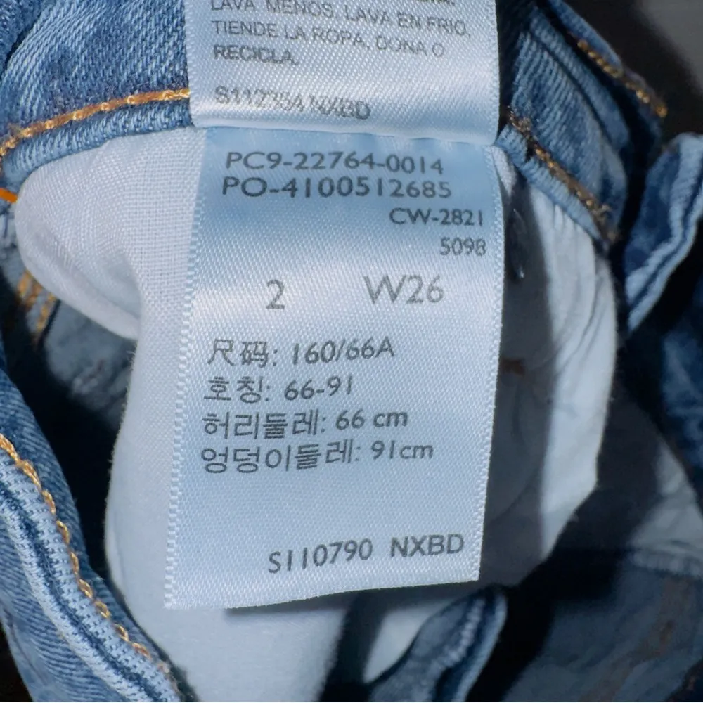 Denizen from Levi's Women's Medium Wash Blue High Rise Cut Off Distressed Shorts - Image 5