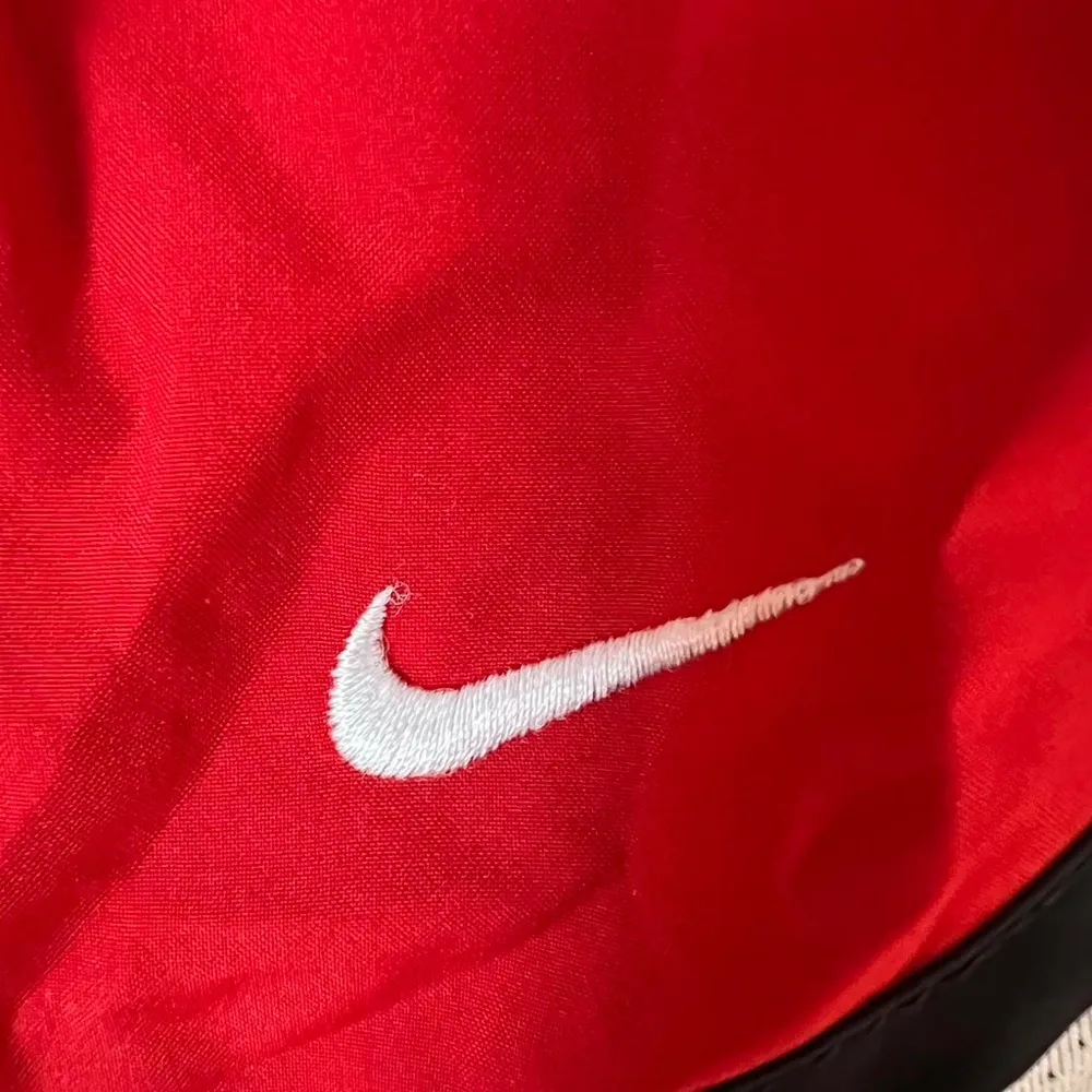 Nike red and white running shorts with embroidered logo - Image 3