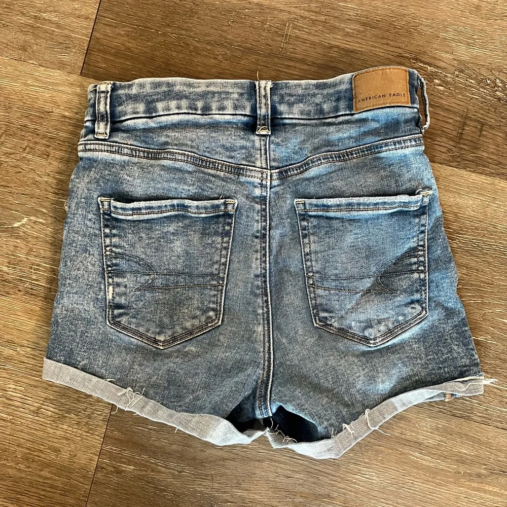 American Eagle Next Level Stretch Curvy High Rise Shortie Distressed Denim Short - Image 2