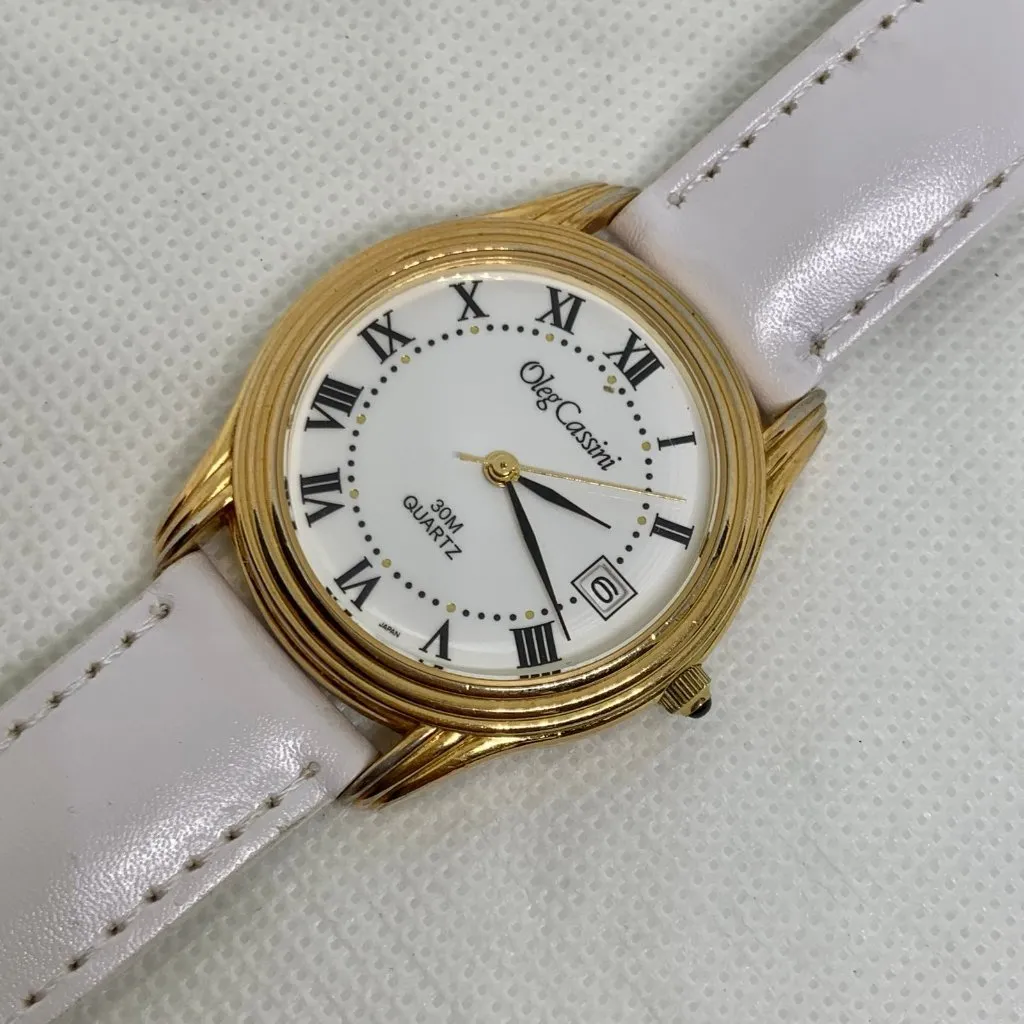 Oleg Cassini date watch gold tone 35mm Roman quartz white leather running - Image 2