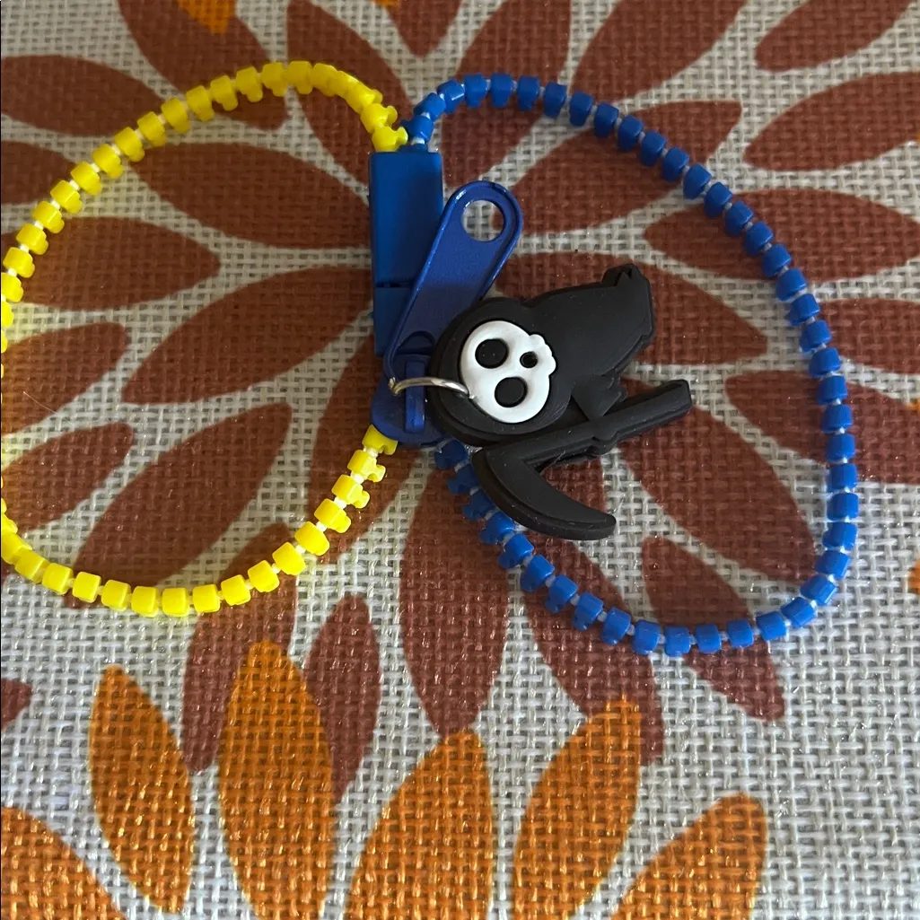 Yellow and Blue Zipper Bracelet with Skull Charm - Image 2