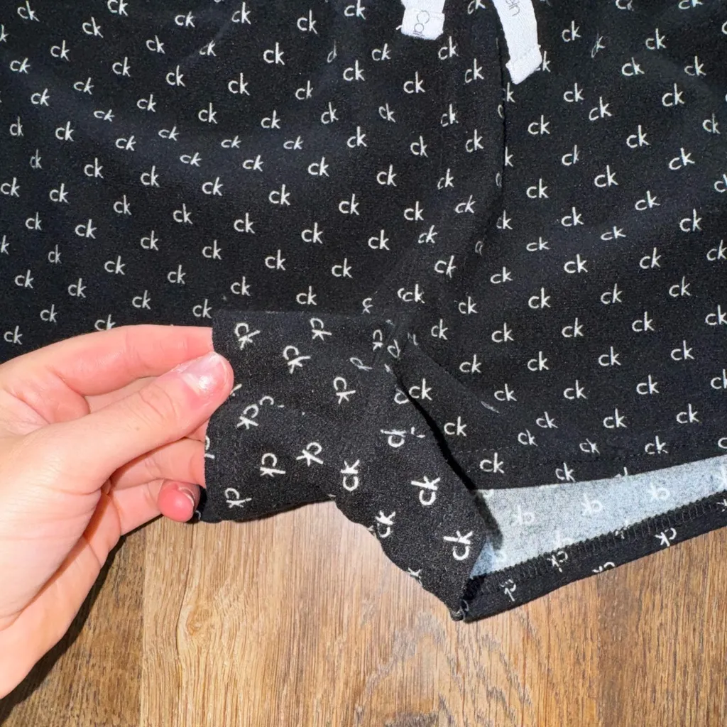 Calvin Klein Black Shorts with White Logo Pattern - Image 2